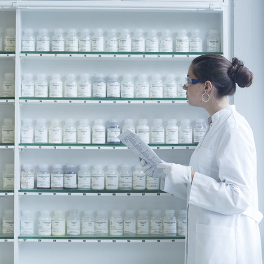 Woman looking at the pills shelves